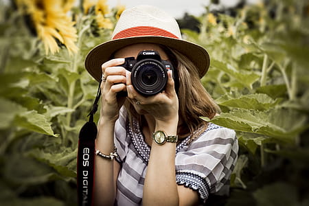 Selective Focus Photography of Woman Holding Dslr Camera thumbnail