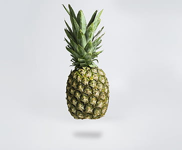 pineapple on white surface thumbnail