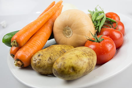 carrots, potatoes, and tomatoes on plate thumbnail