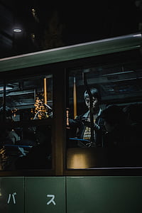 people inside green bus during nighttime thumbnail