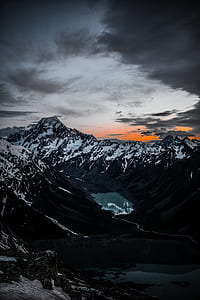 snow-covered mountains during cloudy day thumbnail