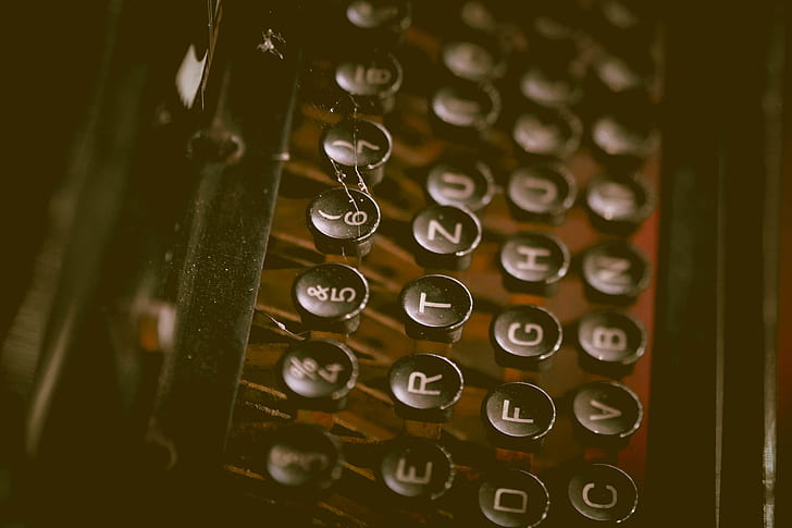 selective focus photography of black typewriter