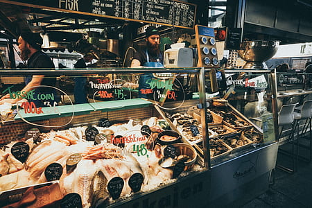 man standing near the baine marie counter thumbnail