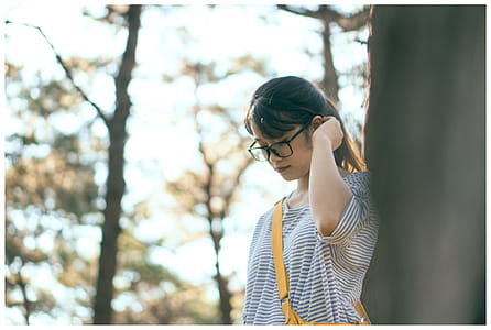Woman Walking Under Trees thumbnail