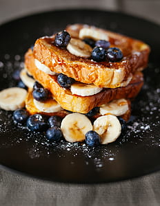 brown and black pastry on black cermiac plate thumbnail