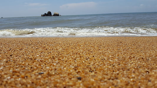 body of water under blue sky thumbnail
