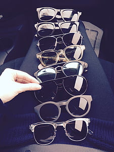 black sunglasses lot on black textile thumbnail