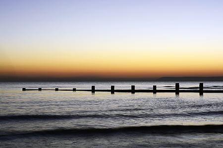 beach dock during golden hour thumbnail