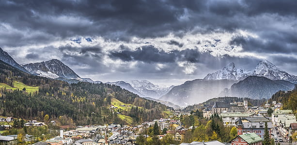 green trees near mountain during daytime thumbnail