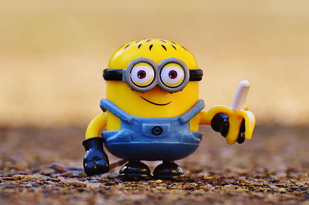 selective focus photography of Minion holding banana toy thumbnail