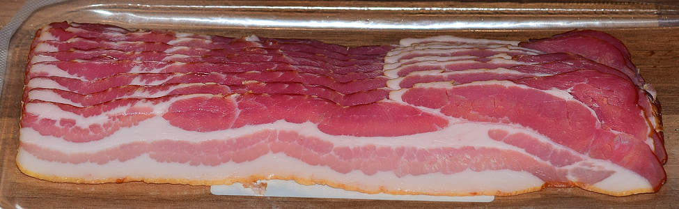 raw meat on top of clear plastic container thumbnail