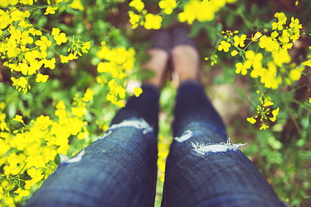 person wearing distressed blue denim skinny jeans thumbnail