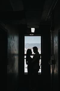 silhouette photography of couple hugging thumbnail
