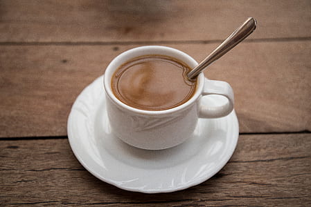 white mug with brown liquid thumbnail