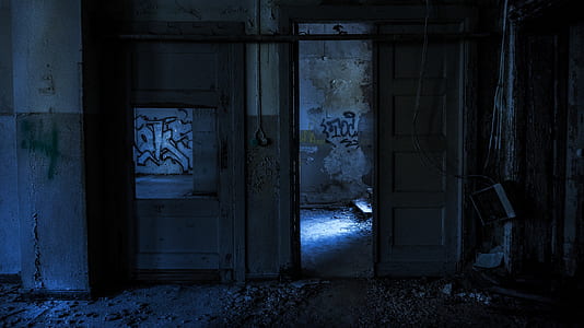 opened door beside gray wall thumbnail