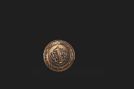 Round Gold-colored 1 Coin thumbnail