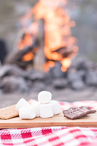 selective focus photography of marshmallows beside chocolates thumbnail