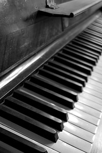 close-up grayscale photo of piano thumbnail