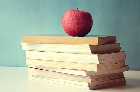 Stack of books with a red apple thumbnail