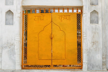 closed yellow metal gate thumbnail