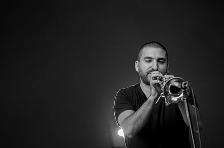 man playing horn musical instrument thumbnail