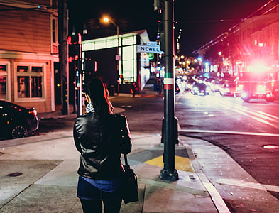 women's standing on sidewalk thumbnail