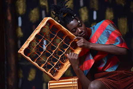 Photography of a Guy Leaning on Plastic Bottle Crate thumbnail