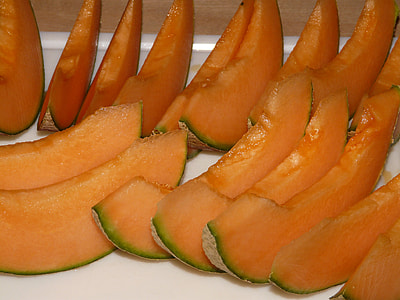 sliced cantaloupes on white surface thumbnail