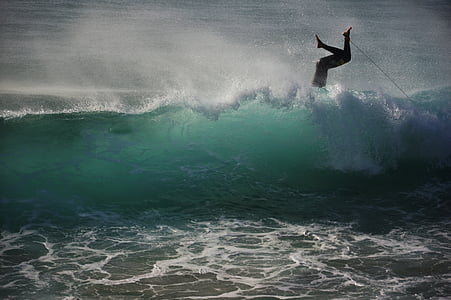 photo of person falling on surfboard in body of water thumbnail