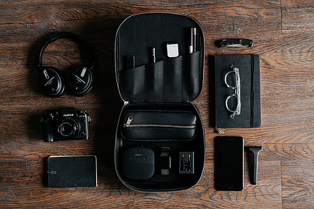 black DSLR camera on brown wooden floor thumbnail