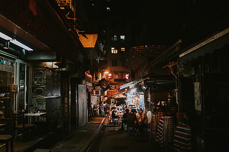 people near houses during nighttime thumbnail