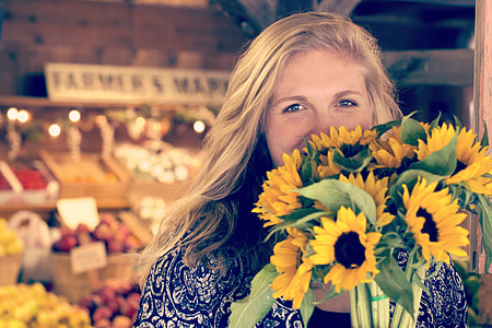 woman holding sunflower bouquet thumbnail
