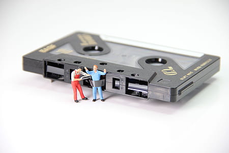 black cassette tape with man figurine thumbnail