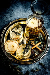 clear glass decanter beside shot glass on round gray tray thumbnail