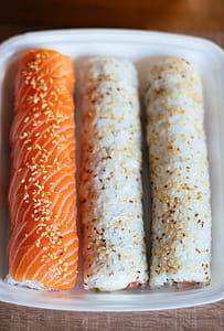Three Sushi Rolls in White Plastic Container thumbnail