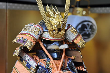 gold and orange samurai helmet on display thumbnail