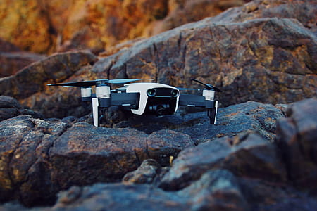 Shallow Focus Photography of White and Black Quadcopter Drone thumbnail