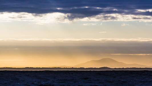landscape photo of mountain under nimbus clouds thumbnail