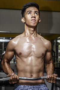 Photography of Man Carrying Ez Barbell thumbnail