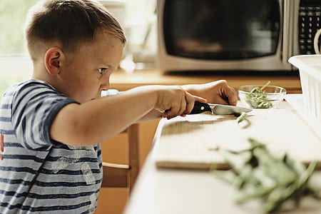 boy chopping string beans pod thumbnail