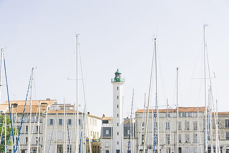 white and green wall painted tower during daytime thumbnail