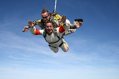 photography of two man doing sky diving during daytime thumbnail
