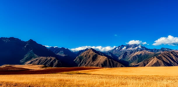 desert surrounded by mountains under clear sky thumbnail