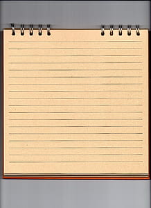 unwritten brown spiral notebook on gray surface thumbnail