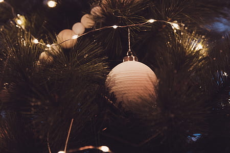 white bauble hanging on Christmas tree thumbnail