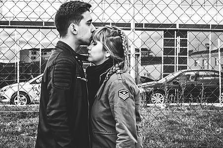 man kissing woman's forehead thumbnail