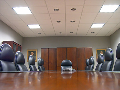 brown wooden meeting office table and chairs set inside white room thumbnail