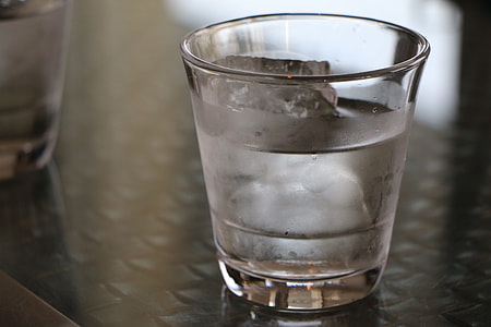 water with ice in drinking glass thumbnail