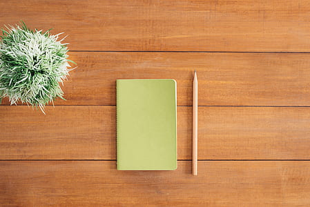 White Notes Beside a Pencil on Brown Wooden Surface thumbnail