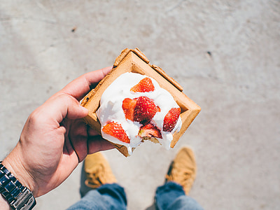 person holding cake with strawberry thumbnail